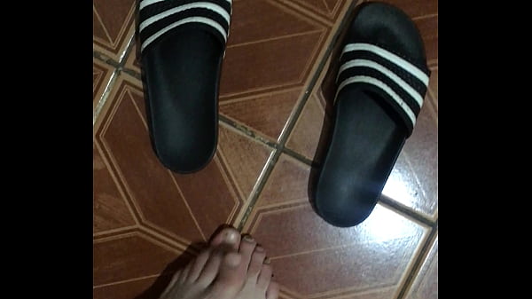 man's foot rubbing himself
