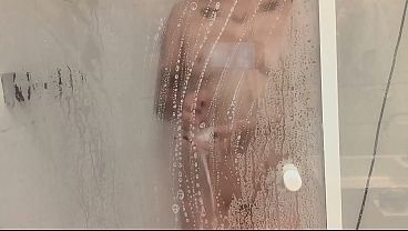 Hot nerdy slut in the shower giving a great blowjob and getting a load of cum.