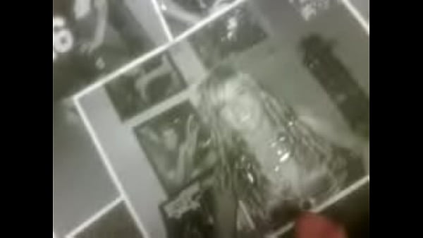 Guy watching porn and cumming on girls pics