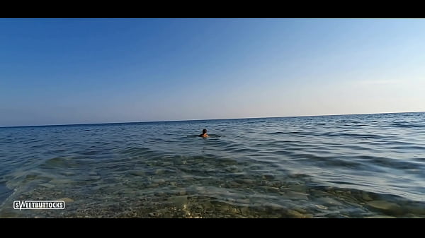 Totally naked on the beach