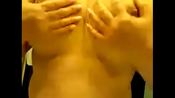 Mature playing with her tits