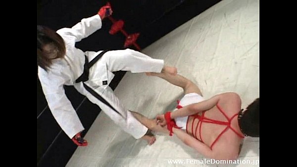 Gagged slaved in bondage is b. up inside the ring