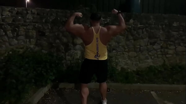 Muscle flexing after gym in the carpark