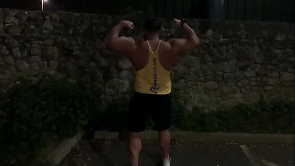 Muscle flexing after gym in the carpark