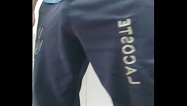 A well-endowed Brazilian man urinating and showing his thick penis to his female friends.