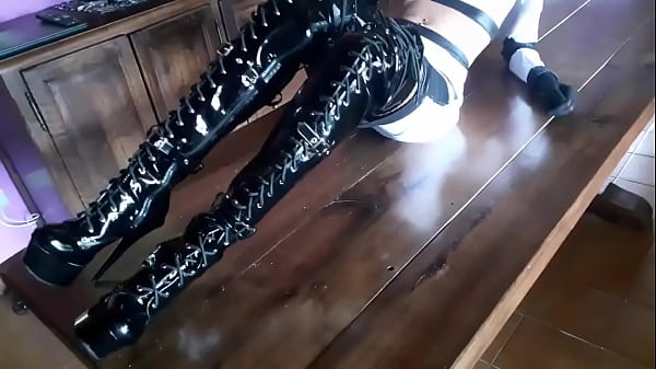 On a table showing my black boots over the knee
