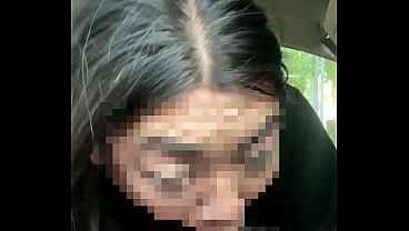 Asian giving head to BBC while driving