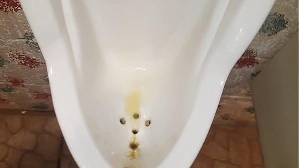 Pissing at public urinal, showing power of my k...