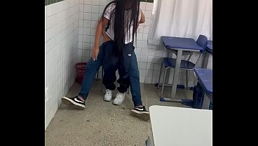 Hot 18-year-old young woman from school getting a big cock from her well-endowed friend in the classroom.