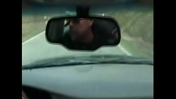 Horny chick sucks her hubby while he is driving a car