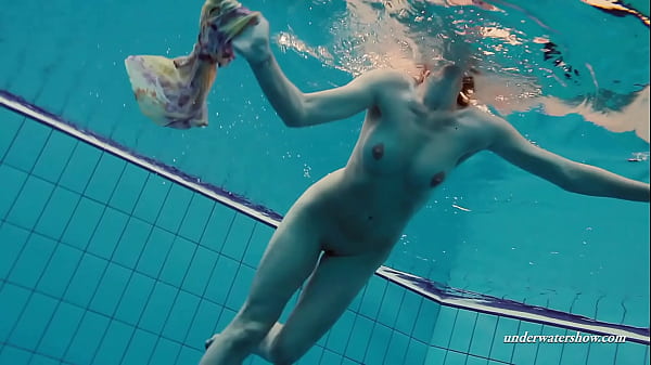 Floating babe in the swimming pool naked