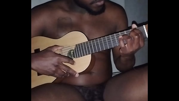 Translating other meanings of horns in the air while singing and playing guitar naked