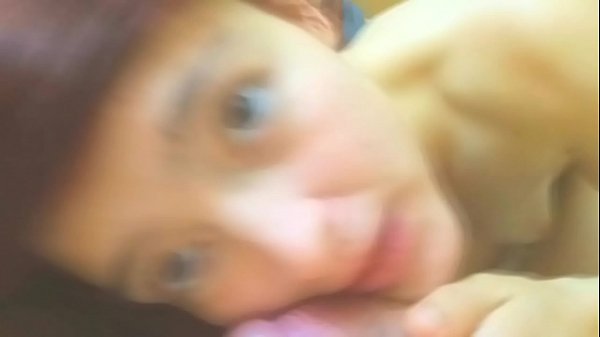 Sweet redhead gives her boyfriend a blowjob while he records her