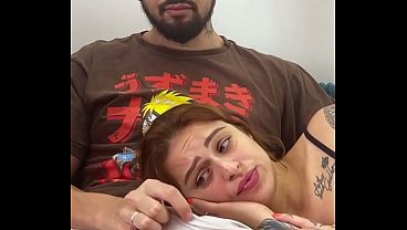 Hot redhead roommate lies in nerd's lap while watching a movie and sucks him off until he cums hard on her face!