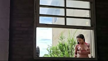 Taking a bath with the danger of the neighbor peeking in.