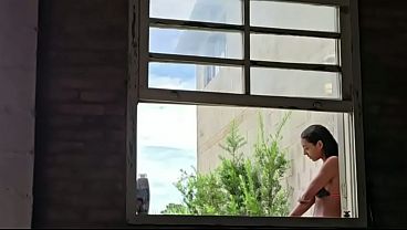 Taking a bath with the danger of the neighbor peeking in.