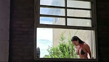 Taking a bath with the danger of the neighbor peeking in.