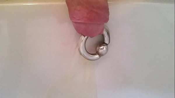 Download Video - Taking a piddle with a 8mm pierced prince albert