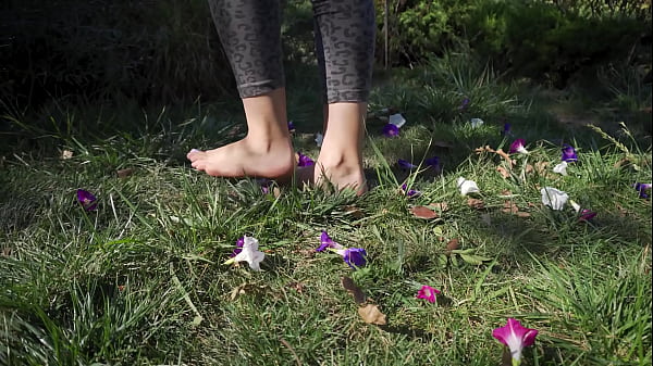 Crushing Flowers Barefoot In The Grass