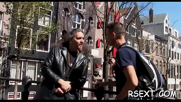 Gorgeous hooker puts condom on dick and gives sexy blowjob