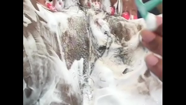 Black hunk shaves babe's hairy pussy and gives her a good lick