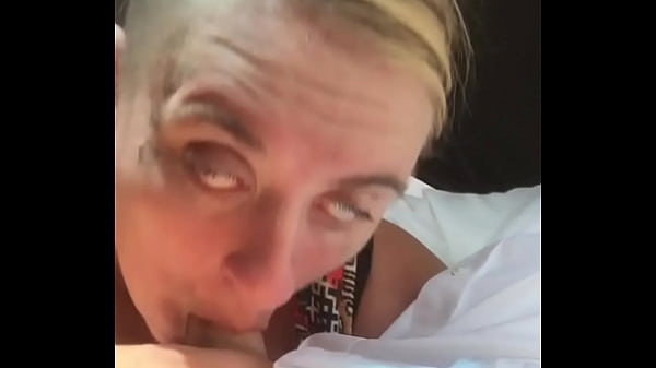 Trailer trash whore flashes her massive tits in public during a blowjob where she lets a guy cum in her mouth