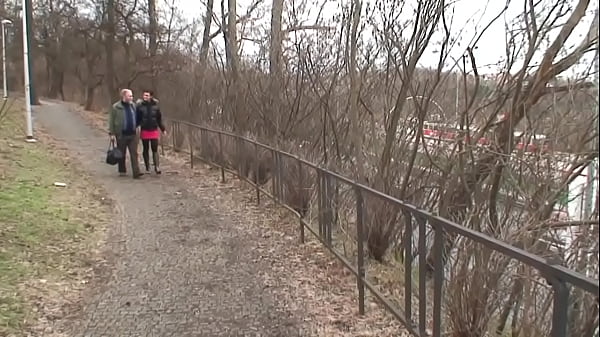 In the park, the young brunette with small natural tits gets warmed up by an older man and swallows all the cum