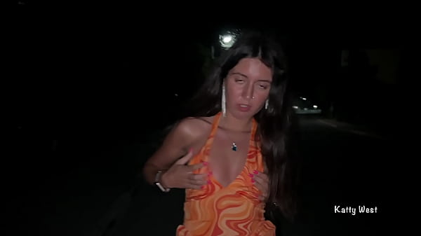 A slut walks down the road and shows her pussy to passers-by