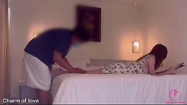 A Thai masseur massages a beautiful female client.