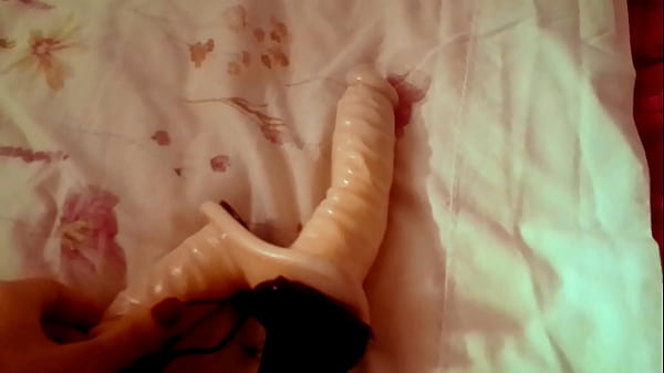 Ariel Ortiz masturbates with her double dildo in her room when her husband goes to work