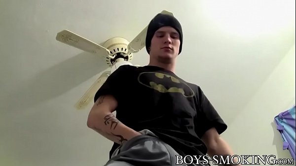 Inked emo twink smoking cigarettes while jerkin...