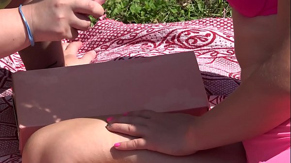 Two lesbians with big asses outdoors use a new sex toy and masturbate with it to orgasm with a squirt.