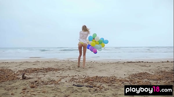 Download Video - Skinny Italian MILF blondie Farncy Torino plays with balloons on the beach