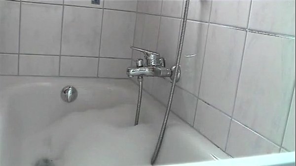 Horny, wet secretary - striptease in a bathtub