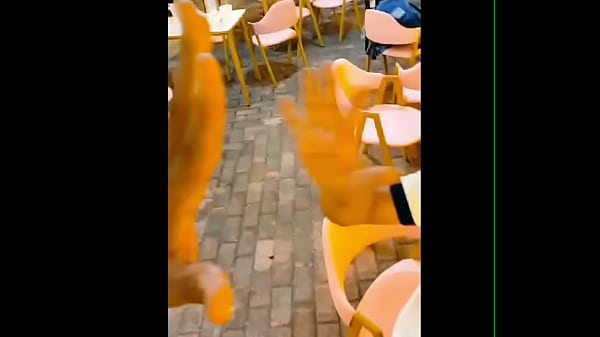 Giant man compares huge hand to small man