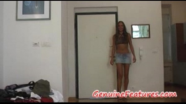 Two beautiful ladies in miniskirts on a couch