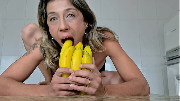 Hairy pussy MILF fucking bananas in the kitchen