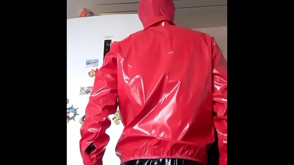 Download Video - Guy in red pvc shirt and black latex suit