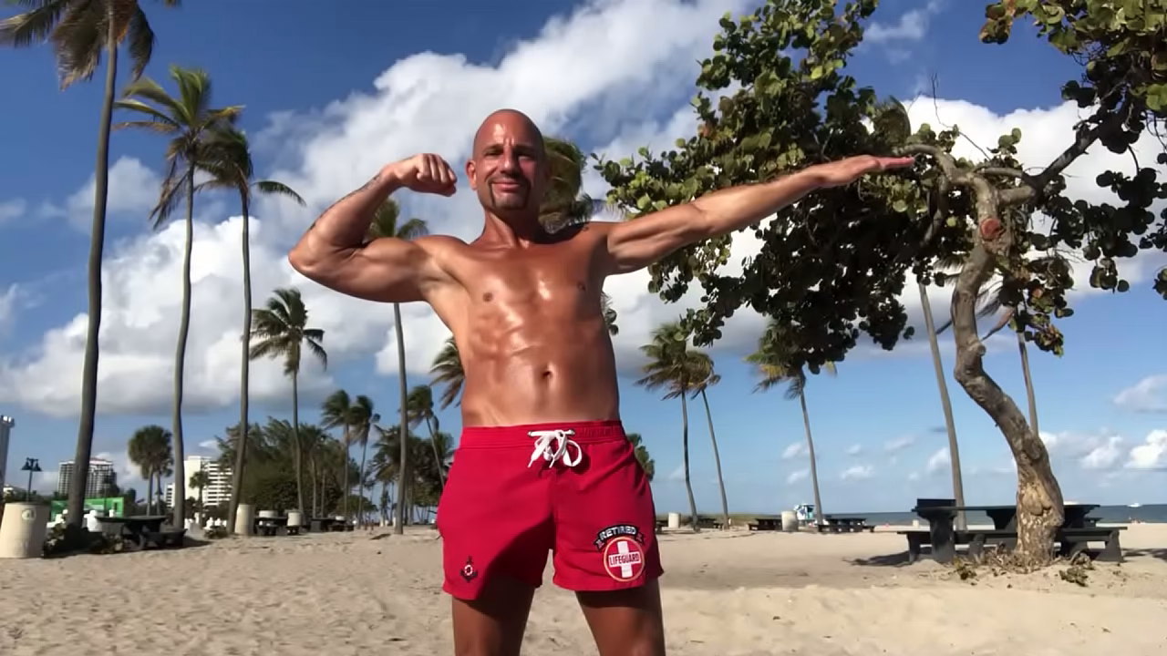 BEACH BODY LIFEGUARD PORNSTAR FLEXING AT THE BEACH