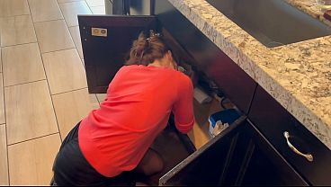 THE MAINTENANCE MAN HELPS WITH A LEAK
