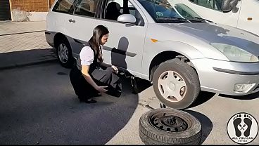 DIRNDL SLUT GETS DIRTY AND OILY CHANGING TIRES