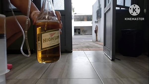 Download Video - Tattooed ass sissy giving herself a 1l enema at the open door