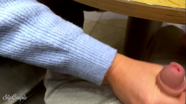Cute Babe gives Blowjob in Public Toilet after perfect Handjob under the Table in Fast Food Restaurant