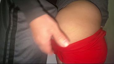 Big-assed woman in a thong grabs a stranger's penis.