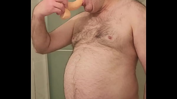 Locked and nude Martin Lavallée sucks a large dildo during Locktober!