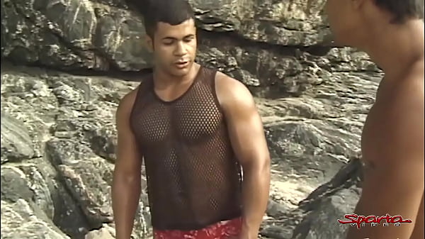 Download Video - Two Big Hard Dicked Dudes Mouth Fucking A Tanned Twink On The Beach&excl;