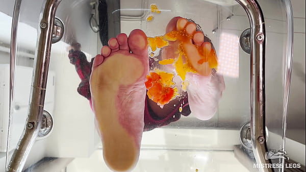 Squeezing juice from cherry tomatoes with my bare feet POV