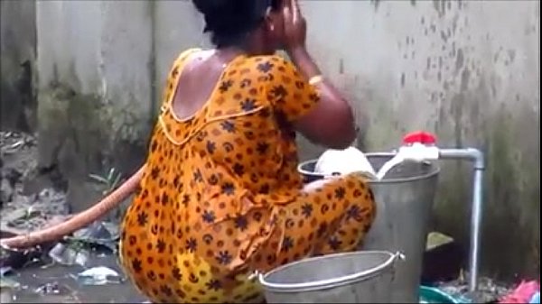 indian couple bathing out side