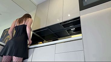 Hot sexy long legs brunette wife in black and red fishnet stockings with a satin nightie teases in the kitchen