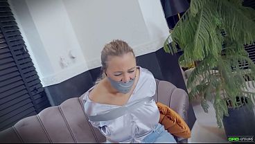 Beth - Secretary wearing satin blouse and Jeans tied up and tape gagged in tape bondage